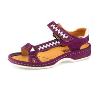 A single women's sandals in deep cerise suede with woven pattern details on the straps, a tan interior, and grey heel accents, shown on a white background.