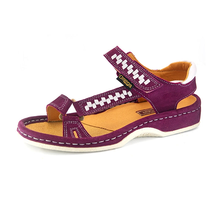 A single women's sandals in deep cerise suede with woven pattern details on the straps, a tan interior, and grey heel accents, shown on a white background.