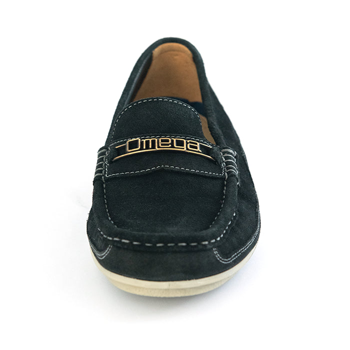 A single black suede loafer slip-on shoe with a gold-tone metal 'Omega' logo on the strap, shown from a front-facing perspective on a white background.