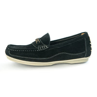 A black suede loafer slip-on shoe with white contrast stitching, a small gold-tone metal accent on the vamp, and a cream-colored sole, shown from a side profile on a white background.
