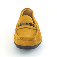 A single mustard yellow suede loafer slip-on shoe with a black metal Omega logo bar across the vamp, shown from a front-facing perspective on a white background.