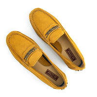 A pair of mustard yellow suede penny loafers with a metallic 'Omega' logo on the vamp, displayed on a clean white background.