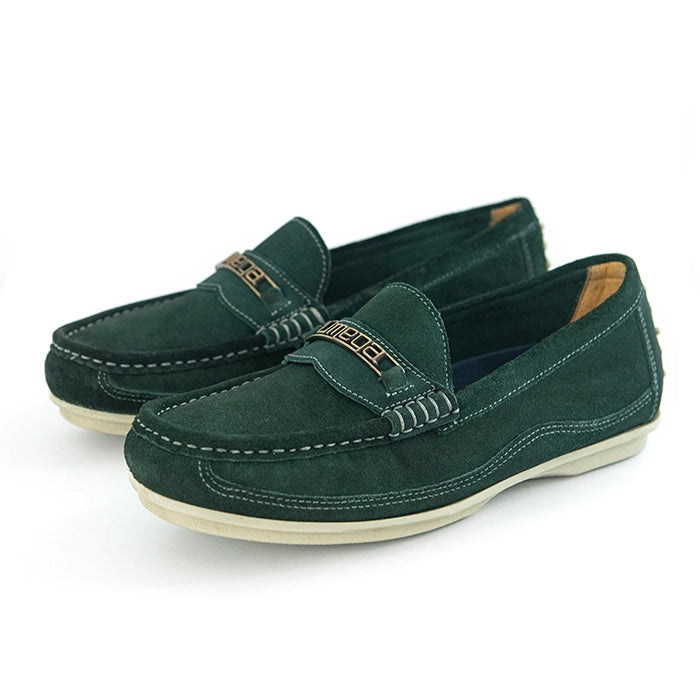 A pair of dark green suede penny loafers with a gold-tone metal bar across the vamp and a cream-colored sole, shown on a white background.