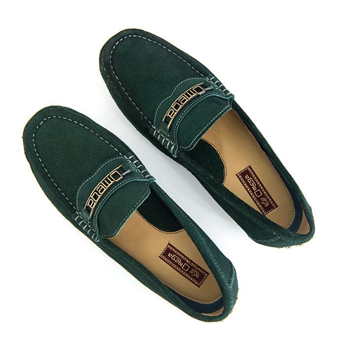 A pair of dark green suede penny loafers with gold-tone 'OmegaI' branding on the strap, displayed on a clean white background.